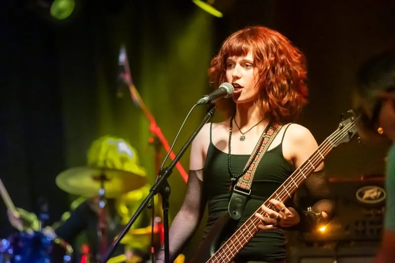 Bassist mid-motion